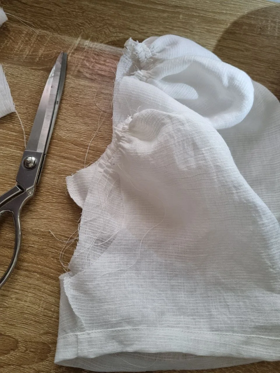 White fabric and garment details in the studio