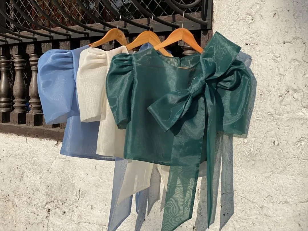 Colorful garments displayed in the Rose and Betty studio